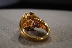 a gold ring sitting on top of a table