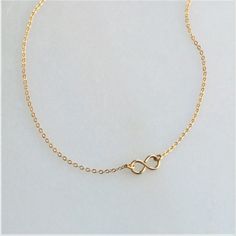 This gold infinity necklace is the perfect daily reminder that some things are for infinity! A wonderful addition to your minimalist jewelry collection or as a meaningful gift! •100% 14kt Gold Water friendly Model is wearing 16 inch in photos. Minimalist Gold Infinity Jewelry, Dainty Infinity Jewelry For Bridesmaid Gift, Minimalist Infinity Gold Jewelry, Minimalist Infinity Necklace With Delicate Chain, Dainty Gold Infinity Necklace, Minimalist Gold Infinity Necklace, Minimalist Infinity Gold Necklace, Adjustable Minimalist Infinity Necklace, Minimalist Adjustable Infinity Necklace