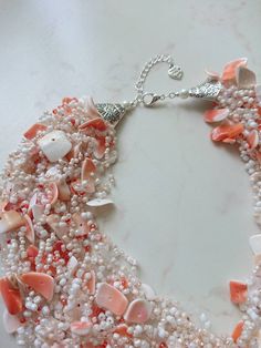 Natural shells necklace, Orange seashell necklace, Mermaid style jewelry, Tropical beach wedding bridal necklace, Crocheted necklace for her. Crocheted natural shells beach party style necklace with your choose of shell chips and glass seed beads. A light, beautiful and flexible piece of jewelry, it will be a great addition to an evening or a wedding gown. It might be a perfect gift for her for a birthday, anniversary or another occasion. Measure: length (flexible): 48 cm (19 inches) + 4 cm chai Elegant White Strand Beaded Necklaces, Silver Beaded Jewelry For Beach Wedding, Handmade Pearl White Shell Necklace, Elegant Shell-shaped Beaded Necklaces For Beach, White Ocean-inspired Necklace In Mother Of Pearl, Bohemian Silver Jewelry For Beach Wedding, Bohemian Beaded Jewelry For Destination Wedding, White Mother Of Pearl Ocean-inspired Necklace, White Mother Of Pearl Shell For Wedding