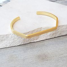 The Gold Minimalist Cuff Bracelet brings a classic style to your everyday piece. With a polished finish, this skinny bracelet is 14K gold filled. You can wear this piece on its own or stack it with other HLcollection bracelets. PRODUCT DETAILS: 4 mm wide bracelet. Open cuff - will fit most wrists MATERIALS: 14K Gold Filled 14K Gold Filled jewelry is not the same as gold-plated jewelry. It contains 5% of solid gold and is done by a process of heat bonding. The layer of gold is permanently bonded Adjustable Matte Gold Minimalist Bracelet, Minimalist Stackable Gold Bangle Bracelet, Minimalist Stackable Cuff Bangle Bracelet, Adjustable Yellow Gold Minimalist Cuff Bracelet, Minimalist Stackable Cuff Bangle, Minimalist Adjustable Yellow Gold Cuff Bracelet, Minimalist Stackable Gold Bracelet, Minimalist Cuff Bangle Bracelet, Minimalist Stackable Gold Cuff Bracelet