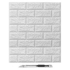 a white brick wall with a pen in front of it