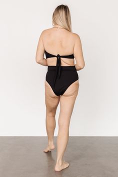 Baltic Born best-seller! Classic Black High waist style bikini bottom Adjustable front wrap tie detail Moderate coverage 80% Nylon, 20% Spandex Hand wash cold Trina is 5'6, cup size 32D, size 2 and is wearing size S Victoria is 5'7, cup size 34D, size 8/10 and wearing size L Bra Friendly High Waist Beachwear Swimwear, High Waist Bra Friendly Beachwear, Tie-side Bottom Swimwear With Built-in Bra For Sunbathing, Chic 4-way Stretch Swimwear For The Beach, Tankini With Built-in Bra And Tie-side Bottom For Poolside, Chic Tie-side Bottom Swimwear For Pool, Sunbathing Tankini With Tie Back And Side Bottoms, Chic Tie-side Swimwear For Pool, Swim Bottoms With Built-in Bra