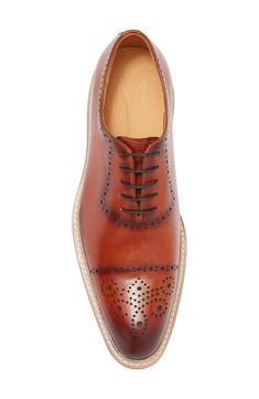 Crafted from a single piece of leather, this handsome oxford offers elevated appeal. Leather upper and lining/synthetic sole Imported Luxury Cognac Oxfords For Semi-formal, Semi-formal Brown Oxfords With Perforated Toe Box, Semi-formal Leather Oxfords In Cognac, Semi-formal Cognac Oxfords With Brogue Detailing, Masculine Brown Leather Oxfords, Mens Oxfords, Single Piece, Oxford, Leather Upper