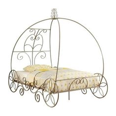 a metal bed frame with wheels and a white bedspread on the bottom side