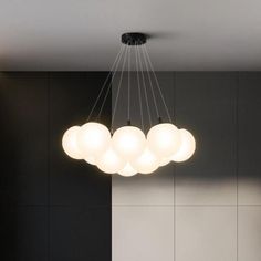 a modern chandelier hanging from the ceiling