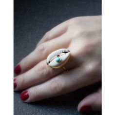 A reminder that sunny days are on the horizon, this ring is carefully handcrafted from 18k gold over silver featuring a cowry marked with a turquoise bead. Style it with its matching layered necklace from the Marina collection. Handmade from 18-karat Yellow Gold Over Sterling Silver (1 micron plating). We suggest to avoid contacts with soaps, detergents, chlorine and any other chemical substance that could alter the original characteristics of your jewel. When it is not worn, keep your jewelry p Adjustable Turquoise 14k Gold Jewelry, Adjustable 14k Gold Turquoise Jewelry, Bohemian Yellow Gold Jewelry With Natural Stones, Unique Turquoise Jewelry For Everyday, Bohemian 14k Gold Gemstone Jewelry, Adjustable Artisan Yellow Gold Jewelry, Adjustable 14k Gold Bohemian Jewelry, Handmade Gold Plated Open Ring Jewelry, Handmade Open Ring Jewelry For Beach