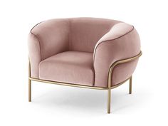 a pink velvet chair with gold frame