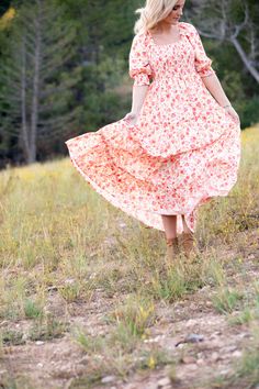 Embrace the floral frenzy with our Celeste Dress. This full-length frock features a feminine flower pattern that will effortlessly brighten your day. The smocked, figure-flattering bodice and ultra-sweet puff sleeves nicely balance the twirl-worthy skirt, creating the perfect summer ensemble for romantic date nights or family-filled picnics at the park. STYLE INFO & CARE The smocked bodice for a flexible, comfortable fit Tiered Skirt Fully lined 100% polyester Tie detail in the back Maternity fr Romantic Date, Date Nights, Romantic Dates, Tier Skirt, Tiered Skirt, Floral Maxi, Brighten Your Day, Floral Maxi Dress, Flower Pattern