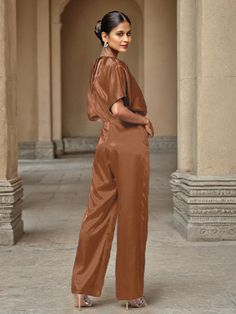 This soft satin jumpsuit features a flattering v-neck design, making it the perfect choice for mothers of the bride. Its dress pantsuit style provides comfort and elegance, while its high-quality material ensures a polished look. Stay stylish and comfortable on that special day with our jumpsuit. Dress Pantsuit, Dress Pant Suit, Satin Jumpsuit, Belt Jumpsuit, Peacock Green, Mother Of The Bride Dress, Dress With Belt, Different Fabrics, Mother Of The Bride Dresses