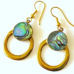 "This is a stunning pair of vintage hand crafted Abalone and brass Modernist circle earrings by local artist Steven Battelle. These earrings are exceptionally beautiful with a rich patina to the brass. A Modern yet organic design that will compliment any outfit... You will be certain to get many compliments! *Steven Battelle has followed a singular, somewhat circuitous route to his current incarnation as a designer of unique treasures of wearable art. Diverging from an early interest in painting Handmade Vintage Hoop Jewelry, Brass Round Earrings For Jewelry Making, Round Brass Earrings As Gifts, Artisan Brass Earrings, Vintage Round Hoop Earrings With Ear Wire, Handmade Small Hoop Vintage Jewelry, Handmade Vintage Small Hoop Jewelry, Vintage Small Hoop Handmade Jewelry, Vintage Small Hoop Jewelry Gift