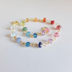 This colorful , beaded , handwrapped bracelet   is made with a great variety of  different gemstone rondelles,  Peridot, Moonstone, Citrine, Rose Quarz,Rhodolite Garnet, red agate, few apatite and Carnelian  are present This  pretty, simple bracelet  will be perfect   as an every  day jewel,or  as a gift  The bracelet measures 18 cm   7.08 Gemstones range is 3-4  mm  and the bracelet  it's finished with a gold filled spring ring clasp Please note that you will receive the exact bracelet shown in Multicolor Gemstone Beads Bracelet With Czech Glass, Multicolor Czech Glass Bracelets With Gemstone Beads, Multicolor Czech Glass Gemstone Beads Bracelets, Colorful Faceted Beads Bracelets As Gift, Rainbow Faceted Beads Bracelet For Jewelry Making, Colorful Faceted Beaded Bracelets, Dainty Multicolor Gemstone Beads Bracelets, Multicolor Gemstone Beaded Bracelets For Jewelry Making, Dainty Multicolor Gemstone Bracelet