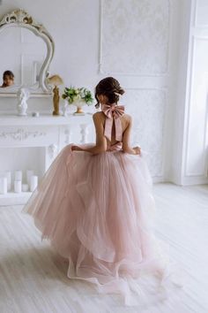 Introducing the enchanting Gwenevere Ruffled Tulle & Satin Flower Girls Dress, a masterpiece designed to transform any special occasion into a fairy tale. This exquisite dress is crafted with the utmost attention to detail, featuring a smooth satin halter neckline that cascades into a mesmerizing sea of ruffled tulle, ensuring your little angel feels nothing short of a princess. The pièce de résistance? An oversized, decorative satin bow at the back of the neck, adding a touch of grandeur and so Flower Girl Dresses Pink, Baby Christening Outfit, Satin Flower Girl Dress, Girls Communion Dresses, Wedding Party Flowers, Flower Girls Dress, Pink Flower Girl Dresses, Flower Girl Crown, Girls Crown