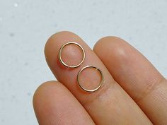 Pair of 14k gold filled hoop rings.Choose from drop down menu gauge and diameter24g22g20gInner diameter 6mm8mm10mm Dainty Yellow Gold Small Hoop Septum Ring, Hypoallergenic Gold Small Hoop Piercings, Gold Hypoallergenic Hoop Piercings, Simple Gold Hypoallergenic Piercings, Hypoallergenic 14k Gold Small Hoop Septum Ring, Minimalist Gold Hypoallergenic Cartilage Earrings, Tiny Simple Gold Cartilage Earrings, Dainty Hypoallergenic Round Nose Rings, Dainty Hypoallergenic Septum Ring For Everyday