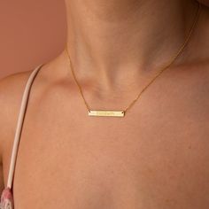 "Stylish and minimalist 14K gold personalized bar name necklace for everyday wear. Great for layering.  Unique personalized gift idea to show love to the important people in your life with a cute, dainty, and creative gift. The custom bar necklace makes a perfect birthday gift for mothers, friends or yourself.  A special anniversary gift for significant others. Just engrave his/her name. It is a perfect gift. It can be dressed up or dressed down depending on the situation. We only use the highes Nameplate Necklace Gold, Gold Bar Necklace Personalized, Custom Bar Necklace, Engraved Bar Necklace, Bar Necklace Personalized, Nameplate Necklace, Mother Birthday Gifts, Gold Bar Necklace, Unique Personalized Gift