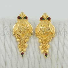 Celebrate the essence of Indian heritage with these radiant 22k gold earrings. Each earring is meticulously designed with traditional patterns that catch the light and add a regal touch to your look. Perfect for both festive occasions and elegant evenings, these earrings are a testament to the rich history of Indian jewelry, offering a blend of classic beauty and modern sophistication. 22k gold earrings handmade jewelry made in India Metal real gold, Purity 22k gold,  length is 3 centimeter and Gold Plated Earrings With Intricate Design For Puja, Elegant Yellow Gold Earrings For Puja, Gold Dual-tone Temple Jewelry Earrings, 22k Gold Plug Earrings For Wedding, Wedding 22k Gold Plug Earrings, Gold Earrings For Festive Puja, Festive Gold Earrings For Puja, Gold Earrings For Puja And Festive Occasions, 22k Gold Earrings For Diwali