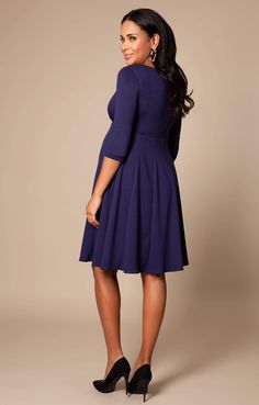 Cut to flatter throughout your pregnancy and after baby arrives too, the gently tailored shape of our Sienna Maternity Dress drapes beautifully over your curves with a soft panelled Ponte Roma skirt and neat princess seams to the bust. A classy and chic look that’ll never go out of style, this smart maternity dress in stylish navy blue is the perfect desk to dinner dress for your maternity wardrobe. Premium Ponte Roma fabric Classic fit and flare shape Soft paneled skirt for structure and a flat Elegant Fitted V-neck Maternity Dress, Elegant Nursing Friendly V-neck Dress, Fitted Long Sleeve Nursing-friendly Dress, Fitted Long Sleeve Nursing Friendly Dress, Chic Maternity Dress Nursing Friendly, Chic Nursing Friendly Maternity Dress, Fitted Solid Color Maternity Dress, Elegant Midi Dress With Empire Waist, Blue Workwear Dress With Pleated Bodice