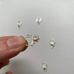 "These are soooooo pretty. Made is 925 sterling silver with tribal details, set with a grounding smokey quartz stone. The rings are all 1cm (.40\") in diameter. The wire is 20 gauge. Each piece is made BY HAND so there may be very slight differences One of the images contains numbers to specify which you would like from the drop down menu." Sterling Silver Septum Ring, Nickel-free Sterling Silver Septum Ring, Silver Open Ring Septum As Gift, Silver Open Ring Septum Gift, Silver Septum Ring For Gift, Silver Septum Ring Gift, Handmade Sterling Silver Septum Ring, Dainty Silver Pierced Nose Rings, Unique Silver Septum Ring