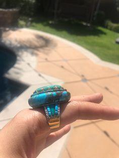 Sterling Turquoise Diamond Ring, Carved Turquoise Ring, Fine Turquoise Diamond Jewelry Gross Weight: 28.8 gm approx Silver: 12-13 gms gms Rosecut Diamond - .4 carats-.5 carats (20 pieces) Turquoise-75-85 carats US Size any size needed - please specify This will be a custom order- natural variances in turquoise color is natural! makes each piece unique. copy Inv#78#7S200NP250compressed350original Unique Turquoise Multi-stone Opal Ring, Unique Turquoise Opal Ring With Multi-stone Design, Turquoise Oval Multi-stone Opal Ring, Artisan Oval Multi-stone Turquoise Ring, Artisan Multi-stone Turquoise Ring, Unique Turquoise Rings With Polished Finish, Turquoise Rings With Polished Finish, Collectible Multi-stone Blue Turquoise Ring, Turquoise Multi-stone Round Opal Ring