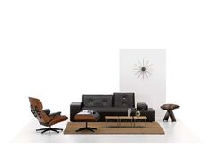 an image of a living room setting with modern furniture and decor on the wall behind it