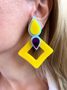 A unique pair of Clip On Earrings with colorful plexiglass parts in rhombus shape. The main color is yellow, light blue and fuchsia and the materials I use are plexiglass parts and metal clip ons in silver color. They open and close with clip on. In Christina Christi Jewels store you can see a lot of designs in Women's Earrings. You can have them in 2-4 Days with DHL EXPRESS SHIPPING MATERIALS - Metal parts. - Plexiglass parts. DIMENSIONS - Total length of Earrings: 8.5 cm (3.3'') - Total width Trendy Yellow Drop Earrings, Colorful Handmade Modern Earrings, Modern Multicolor Dangle Jewelry, Yellow Dangle Plug Earrings As Gift, Trendy Yellow Earrings, Bold Multicolor Drop Earrings, Bold Multicolor Jewelry For Pierced Ears, Bold Multicolor Drop Earrings Jewelry, Modern Yellow Earrings For Party