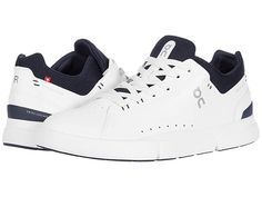 On The Roger Advantage - Men's Shoes : White/Midnight : The third tennis-inspired sneaker to join the On collection co-created with Roger Federer . With its clean lines and minimal stitching, the On The Roger Advantage sneaker demands to be added to your style rotation. Designed to add a stylish contemporary finish to any ensemble. Engineered for long-lasting cushion and comfort. Approved by the Swiss-Maestro himself. A refreshing aesthetic with athletic accents makes The Roger Advantage that es Modern Mid-top Running Sneakers, Dynamic Sneakers With Perforated Toe Box For Running, Dynamic Running Sneakers With Perforated Toe Box, Functional Sneakers With Boost Midsole And White Sole, Functional White Sneakers With Perforated Toe Box, Athleisure Mid-top Sneakers For Running, Modern Low-top Slip-on Sneakers For Running, Modern Sneakers With White Sole For Running, Functional White Low-top Slip-on Sneakers