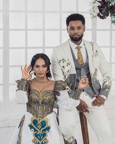 a man and woman dressed in costume posing for a photo