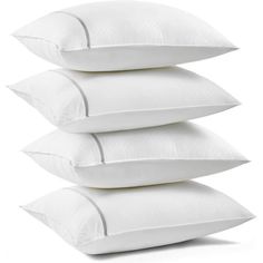 four white pillows stacked on top of each other in front of a white background,