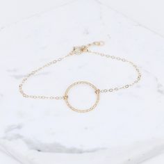 "14K karma gold bracelet - Solid Gold Bracelet, 14k delicate bracelet ★ Circle charm is 14k solid gold, it is about 17mm ★ The chain and all components are 14K solid yellow gold It comes with a 1/2\" extension chain. (If you order a 6\" bracelet, it will be a 6\" bracelet plus 1/2\" extension.) Please read our policies before you place your order. https://www.etsy.com/shop/SashJewelry/policy?ref=shopinfo_policies_leftnav To see other Mother daughter necklace set click here: https://www.etsy.com/ Adjustable Minimalist Bracelets In Recycled Gold, 14k Yellow Gold Bracelet With Simple Design, Minimalist Adjustable Bracelets In Recycled Gold, Minimalist Adjustable Recycled Gold Bracelets, Simple 14k Yellow Gold Bracelet, Dainty Yellow Gold Circular Jewelry, Yellow Gold 14k Bracelet, Dainty Circle Yellow Gold Jewelry, Rose Gold Round Bracelets In 14k Gold Filled