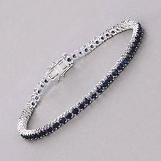 14k Gold Blue Sapphire Bracelet, Genuine Blue Sapphire Rounds Gold Bracelet for Women, Blue Sapphire Gold Tennis Bracelet, Gift for Her Dazzle in the deep blue allure of this 14K white gold tennis bracelet, featuring 6.38 carats of genuine round blue sapphires. Each sapphire is meticulously set to create a seamless line of vibrant color, perfect for adding a touch of luxury to any ensemble. The bracelet's classic design is enhanced by its secure box clasp, ensuring both elegance and peace of min Sapphire Tennis Bracelet For Formal Occasions, Fine Jewelry Sapphire Bangle Bracelet, Luxury Blue Sapphire Bracelets, Blue Diamond Bracelet For Formal Occasions, Elegant Blue Jewelry With Jubilee Bracelet, Blue Formal Bracelet Jewelry, Formal Blue Bracelet Jewelry, Sapphire Tennis Bracelet Fine Jewelry With Prong Setting, Blue Diamond Bangle Fine Jewelry Bracelet