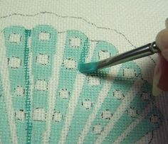 the needle is being used to stitch an image