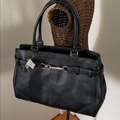 Black Leather Coach Bag, New With Tags. Footed Bottom. Silvertone Buckle Hardware On Front Of Bag. Zipper Top To Close. Inside, One Zippered Pocket And Two Slip Pockets. Black Fabric Lining. Very Roomy Interior. Tassel Detail. 13.5” Wide, 10” High, 5.5” Wide, 8.5” Handle Drop. Coach Retro Bags, Coach Work Bags For Women, Coach Vintage Handbags Worth, Coach Bags Handbags 2022, Cheap Coach Bags Brixton Baker, Coach Bags Handbags Coach, Luxury Coach Saddle Bag With Main Compartment, 2001 Coach Purse Value, Coach Purse Coach