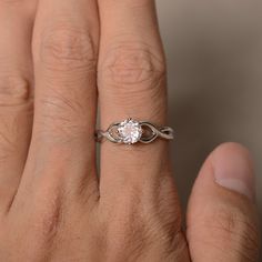 This is a gorgeous handmade creation. Its beauty is its simplicity & Elegance. The 6*6 mm round shape faceted natural Morganite is crafted in solid sterling silver and with rhodium plated. All item is sent in a beautiful gift box If you have any idea of design your ring,pls contact me directly. You can realize more lovely stuff clicking the link https://www.etsy.com/shop/knightjewelry?refshopsection_shophome_leftnav Please leave the correct address and you phone number for delivering success Promise Ring In Diamond White With Gemstone, Promise Solitaire Stackable Rings, Diamond White Diamond Ring For Promise Occasion, Oval Solitaire Stackable Promise Rings, Minimalist Diamond White Ring With Center Stone, Promise Stackable Rings With Center Stone Round Cut, Promise Stackable Rings With Center Stone, Minimalist Promise Ring With Center Stone, Diamond Cut White Topaz Ring Gift