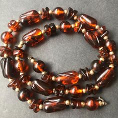 Vintage Tortoise Shell Beaded Necklace 1960's 1970's Jewelry Measurements Length - 22 1/2 inches In very good vintage condition. A nice addition to any collection. D201 Vintage Beads For Jewelry Making, Vintage Jewelry With Large Round Beads, Vintage Faceted Beaded Necklace, Vintage Adjustable Beaded Necklace With Polished Beads, Adjustable Vintage Beads For Jewelry Making, Vintage Adjustable Faceted Beads, Vintage Adjustable Beaded Necklace With Faceted Beads, Vintage Amber Jewelry With Large Beads, Adjustable Vintage Beaded Necklace With Faceted Beads