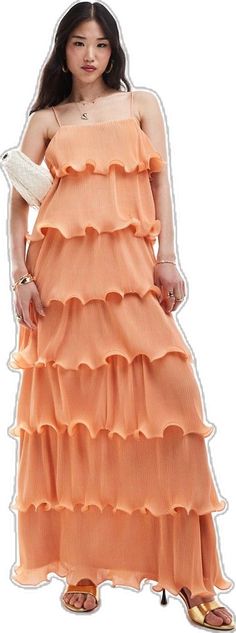 Peach Ruffled Maxi Dress For Spring, Tiered Ruffled Maxi Dress, Spring Peach Maxi Dress With Ruffles, Chic Tiered Maxi Dress With Layered Hem, Spring Orange Dress With Flowy Skirt, Orange Flowy Skirt Dress For Spring, Elegant Orange Pleated Maxi Dress, Layered Maxi Dress For Spring, Spring Layered Tiered Maxi Dress