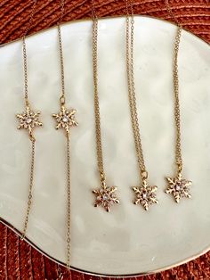 A simplistic and elegant snowflake necklace perfect for the holidays and winter! These are 18k gold and uniquely made designs by me. They are lightweight and you can order them together or individually. Elegant Snowflake, Snowflake Necklace, Winter Jewelry, Christmas Jewelry, Necklace Bracelet, Winter Christmas, Necklaces Bracelets, Jewelry Necklace Pendant, Pendant Necklaces