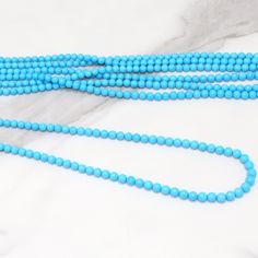 Sleeping Beauty Turquoise 5mm Smooth Rounds Bead Strand Discover the enchanting allure of our 18" Full Bead Strand of Sleeping Beauty Turquoise Smooth Rounds. Each 5mm bead is meticulously crafted from the finest Sleeping Beauty Turquoise, a gemstone renowned for its captivating sky-blue color and minimal veining. Ideal for jewelry designers and stores, these wholesale gemstone beads add a touch of natural elegance to any jewelry piece. Whether you're creating a stunning necklace or a charming b Turquoise Necklace With Round Beads, Turquoise Necklaces With 8mm Round Beads, Turquoise Necklaces With 8mm Beads, Turquoise Necklace With 8mm Round Beads, Elegant Turquoise Necklace With Spacer Beads, Turquoise Beaded Necklaces With 8mm Beads, Turquoise Beaded Necklace With 8mm Beads, Light Blue Beaded Necklaces With Round Beads, Gemstone Beads Wholesale