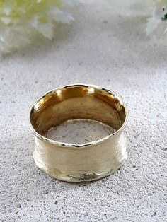 SPIRA Unique Handcrafted Wide Hammered Wedding Ring Solid 9/14 Karat Yellow Gold Brush Finish, Statement Ring, Unique Bohemian unisex ring R-0134-YG Metal Purity: 9k / 14k Style: Wedding Width mm: 9.5 Free Shipping: US & CA: 5-7 days UK: 2-3 days Europe: 4-8 days Australia: 10 days Expedited shipping options are also available during checkout process Handmade Wide Band Wedding Ring, Unique Wide Band Ring For Wedding, Unique Wide Band Wedding Ring, Handmade Thick Band Wedding Jewelry, Handmade Thick Band Jewelry For Wedding, Wide Band Ring Detail Jewelry For Wedding, Elegant Handmade Wide Band Yellow Gold Ring, Elegant Handmade Wide Band Ring In Yellow Gold, Wedding Jewelry With Wide Band Ring Detail