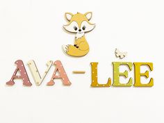 the word ava - lee is made up of wooden letters and an image of a fox