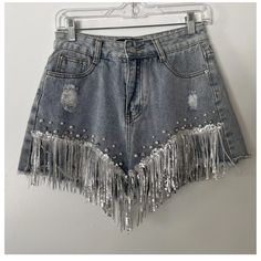 Denim Distressed Shorts From Shop Michella, Perfect For Any Cowgirl Or Western-Themed Occasion. The Shorts Feature A 5-Pocket Design And Button And Zip Closure, With Accents Such As Pearls, Fringe, Rhinestones, And Sequins. Medium Wash. New, With Tags. Perfect Condition. Trendy High Waist Jean Shorts For Parties, High Waist Rhinestone Denim Jeans, High Waist Jean Shorts For Spring Party, Trendy Summer Party Jean Shorts, Spring High Waist Embellished Jeans, High-waist Embellished Jeans For Spring, High Rise Denim Bottoms With Rhinestones, Trendy Denim Blue Bottoms With Rhinestones, Denim Jean Shorts For Night Out