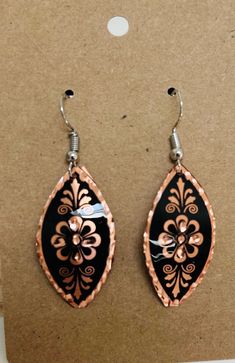 Elegant, handcrafted, cooper engraved Turkish earrings from Istanbul.  These Turkish handmade earrings are a perfect gift for someone special. Crafted from high-quality copper, they feature an intricate engraving that adds a touch of beauty to any outfit. The earrings are perfect for those who appreciate unique and exquisite jewelry pieces. The earrings are designed with a focus on beauty and elegance, making them a great addition to any jewelry collection. The engraved design adds a touch of sophistication to the overall look, making them perfect for both casual and formal occasions. These earrings are sure to impress and make a great statement piece. Engraved Metal Earrings For Gift, Handmade Brown Flower Jewelry, Engraved Metal Earrings As Gift, Nickel-free Copper Flower Drop Earrings, Handmade Copper Drop Earrings, Handmade Bronze Earrings As Gift, Handmade Bronze Earrings For Gift, Traditional Rose Gold Jewelry For Gift, Handmade Copper Gold Flower Earrings