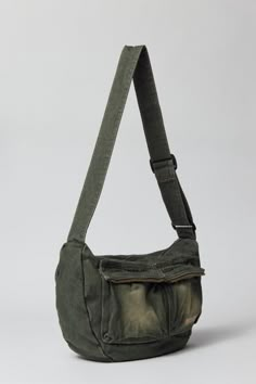 Acid wash crossbody bag by UO's own BDG label. Durable cotton canvas bag with zippered pockets and an adjustable webbing shoulder strap. Urban Outfitters exclusive. Features Crossbody bag from BDG Acid wash cotton canvas Utility style pockets Adjustable webbing strap UO exclusive Content + Care 100% Cotton Spot clean Imported | BDG Acid Wash Crossbody Bag in Olive, Men's at Urban Outfitters Aesthetic Crossbody Bag, Men’s Bags, Goblincore Bag, Cross Body Bag Men, Men Tote Bag, Vintage Sling Bag, Men Crossbody Bag, Vintage Canvas Bags, Crossbody Bag Men