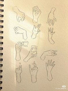 several drawings of hands and fingers on a piece of paper