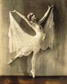 an old photo of a ballerina in white