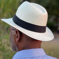 Elegant white Fedora Hat. Hand made in Ecuador with paja toquilla palm. Handwoven by artisans in the Andes mountains of Ecuador.  Hat size medium 7 1/2. Brimm 6.5cm  Grosgrain ribbon OUR HAND CRAFTED HATS PROCESS Paja toquilla, is a palm-like plant which is used to weave our hats and can be found off the coast of ecuador.  the soft middle palm leaves are washed and placed out in the sun to dry. the sun bleaches the straw, making it strong and flexible for easy weaving.  weaving is a unique skill White Fedora Hat, White Fedora, Gentleman Hat, Mens Dress Hats, Mens Fedora, Fedora Hat Men, Dress Hats, Fedora Hat, Hat Sizes