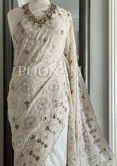 Pure Chikankari saree with very heavy and intricate murri  embroidery, embellished with handwork allover. Pallu and body fully embroidered. The color of the actual product may slightly differ from the pictures. It comes with an unstitched blouse, if you want the blouse stitched please contact me, the blouse can be stitched with an additional cost. Hand embroidered items may have some loose threads. Fabric: Pure Chikankari Work: Chikankari Wash: Hand Wash/Dry Clean Product color may slightly vary due to photographic lighting sources or your monitor settings. NOTE: All our items are handmade and specially customized for our beautiful customers. Please expect minor variations in the actual product as compared to the image displayed. Product color may slightly vary due to photographic lighting Luxury Chikankari Embroidery Blouse Piece In Katan Silk, Saree Bridal Wedding, Lucknowi Saree, Saree Bridesmaid, Chikankari Saree, Chikankari Work, Kantha Sarees, Embroidered Items, Wedding Saree