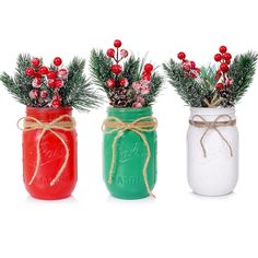 three mason jars with pine branches and berries tied around the top one is red, green, and white