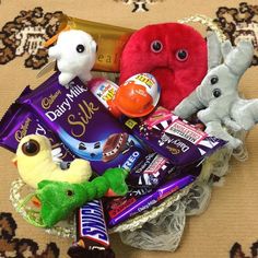 an assortment of chocolates, candy and stuffed animals