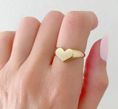 14K Solid Gold Heart Signet Ring. The Leading Trend In Jewelry Today. A Ring Full Of Love So You Can Keep It Close To Your Heart. A Beautiful Gift She Will Treasure Forever. Jewelry Comes In A Cute Gift Box Ready To Present. -All Jewelry Is New And Inspected For Quality Assurance. -Jewelry Is Crafted In Genuine High Quality 14K Gold. -We Do Not Sell Gold Plated. Product Detail: Metal: 14k yellow gold Weight: 4.6 grams Width: 2.2mm Size: 6 1/2 -Engrave Initial Upon Request -Feel Free To Ask Me An Polished Heart Ring For Promise, 14k Gold Polished Finish Promise Heart Ring, Promise Heart Ring With Polished Finish, Yellow Gold Oval Heart Ring For Valentine's Day, Heart Shaped Signet Ring For Valentine's Day, Heart-shaped Signet Ring For Valentine's Day, Heart Ring With Polished Finish For Valentine's Promise, Heart Cut Signet Ring For Anniversary On Valentine's Day, Polished Heart Ring For Promise On Valentine's Day