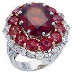 A 11.30-carat dark red spessartite garnet has a seductive appeal when surrounded by 6.36-carat of light red sapphires and 0.78-carat of diamonds. This ring will add a seductive touch to your evening attire. This ring, as with all Zorab Creation pieces, is sent with a unique serial number to validate its authenticity. Ring Size 7.5 Luxury Red Diamond Ring With Polished Finish, Luxury Red Sapphire Ring, Luxury Red Sapphire Ring With Center Stone, Luxury Red Multi-stone Rings, Luxury Red Sapphire Ring With Accent Stones, Red Sapphire, Spessartite Garnet, Van Cleef Arpels, Trendy Accessories