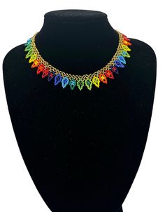 Add a touch of African ethnicity to your style with this authentic multicoloured beaded choker necklace. Handcrafted with utmost precision, this necklace perfectly blends traditional and modern design. Made with high-quality beads, it features a vibrant mix of colours that will add life to your outfit. The necklace has a variety of lengths and is suitable for all occasions. This necklace is perfect for those who love to add a touch of ethnicity to their style. The vibrant mix of colours and intricate design make it stand out from other necklaces. It is perfect for any occasion, whether a casual day out or a formal event.  Colour - Multicolour  Height - 1.6cm Neck Length: Various Lengths:  17inch(43cm) 16inch(40cm) 14inch(36cm) Material :Beads Turban Headwrap, Beaded Choker Necklace, Wooden Earrings, Body Jewellery, Beaded Choker, Cuff Bangles, Intricate Design, Accessories Earrings, Formal Event